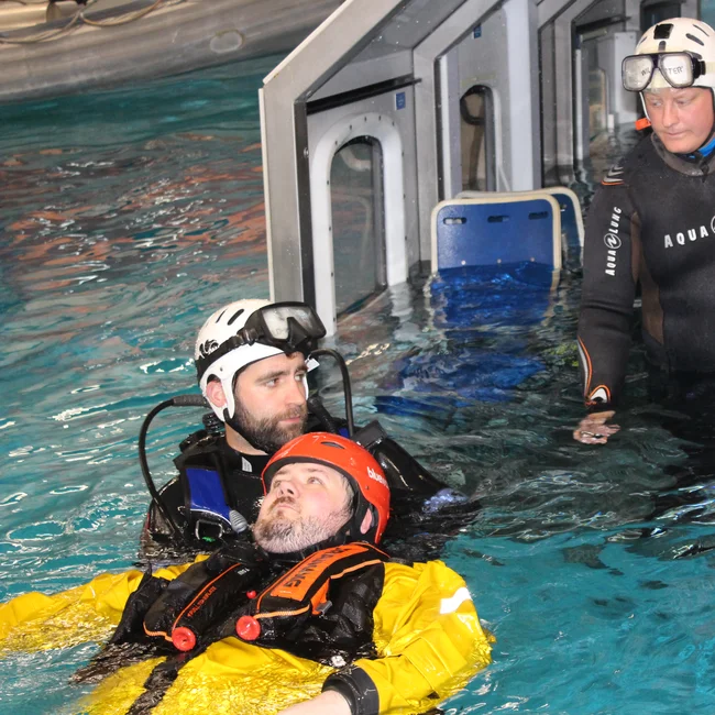 BOSIET training where the trainee saves a person in the pool emulating the sea