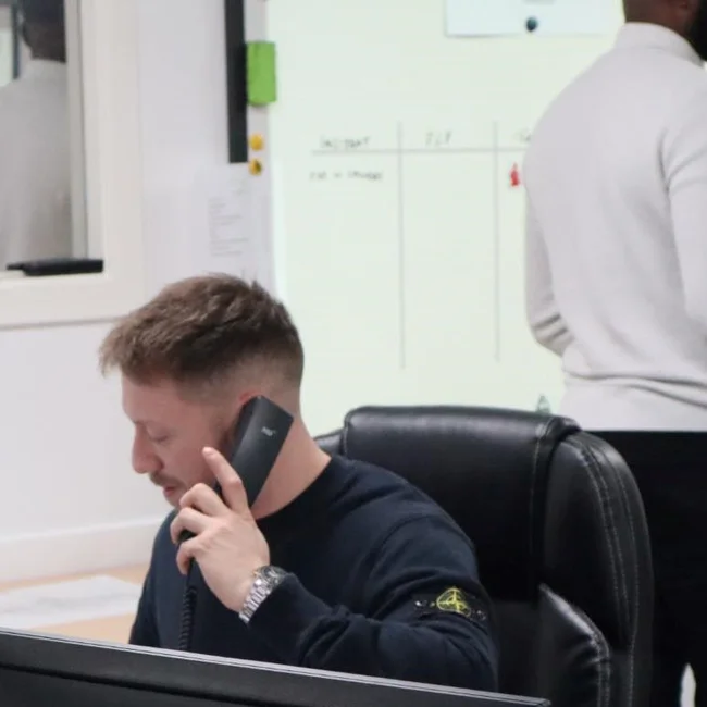 Man speaking on the landline in the command center for crisis management